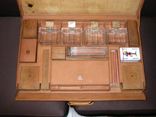 Cased vanity set in leather, glass and wood. By Jean Luce for Cartier, French, 1920s. Dimensions of case 22