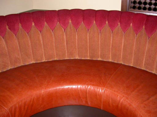 3/4 round dining banquette w/chanelled chenille inside back and leather seat, solid wood frame