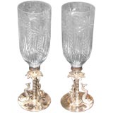 pair of handblown glass shades with palm tree etchings and stand