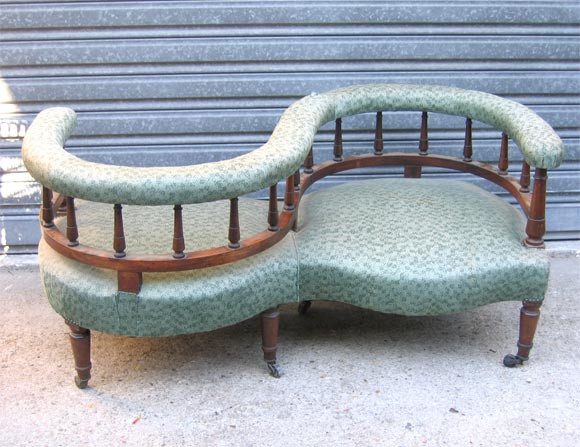 Napoleon III S-shaped settee in palisander. Legs and arm-rest supports baluster shaped. On casters.