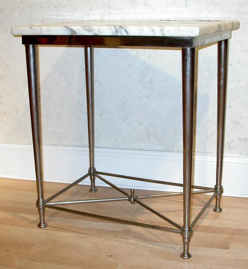 An Art Deco nickel-plated side table having its original grey veined white marble top (