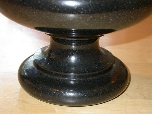 A pair of grey/black granite flower pot holder.