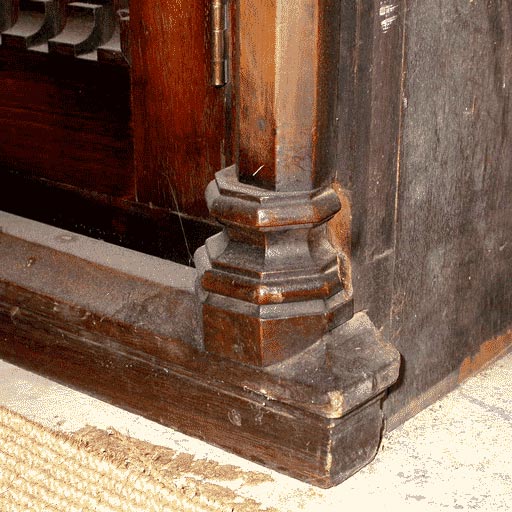 Origanally built into the wall, this book case could stand alone.  It has beautiful wrought Iron fret on the glass.  The mahogany has exceptional graining.  Very Unusual!