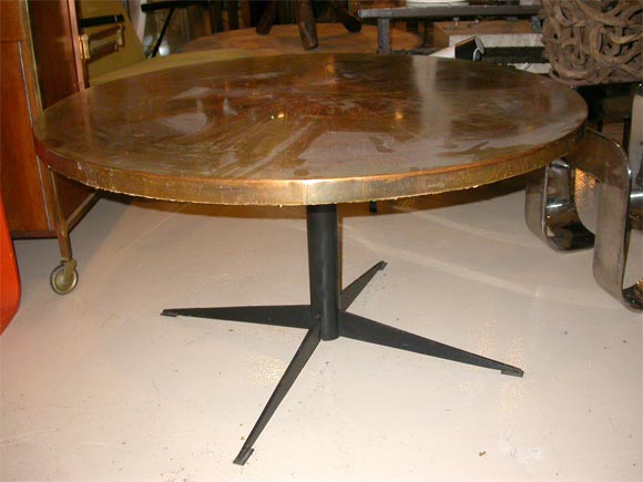 This is a French 1950's Zodiac Table.  Its patened copper, acid etched with a astrological motif.  It has a black iron base.