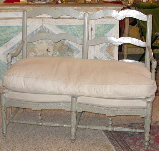 A Louis XVI painted grey banquette with linen covered down cushion
