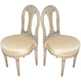 A pair of Louis XVI painted side chairs