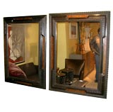 Pair of Carved Ebonized Mirrors