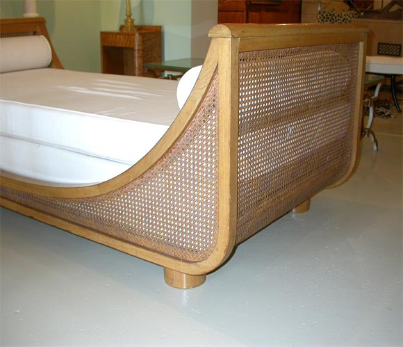 1940's daybed by Jean Royere with caned panels and sides. Documented. Provenance available.