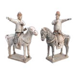 PAIR OF CHINESE POLYCHROMED EQUESTRIAN FIGURES