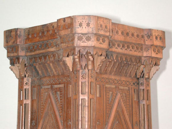 A FANCIFUL ITALIAN 'GRAND TOUR' CARVED AND RETICULATED WALNUT MAQUETTE OF GIOTTO'S BELL TOWER IN FLORENCE WITH MIRRORED INSETS.  The elaborately carved and reticulated walnut tower surmounted by a handsome cornice; each of the four stories with an