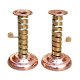 PAIR OF FRENCH ARTS AND CRAFTS BRASS AND COPPER CANDLESTICKS