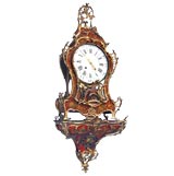 FRENCH LOUIS XV POLYCHROMED SCARLET RED-GROUND CARTEL CLOCK