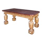 NAPOLEON III GILTWOOD CENTER TABLE WITH BOLDLY CARVED LEGS