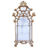 A MASSIVE AND EXUBERANT ITALIAN ROCOCO OCHRE PAINTED WALL MIRROR