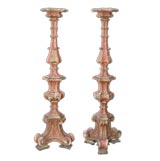 HEROIC PAIR OF ITALIAN BAROQUE CORAL-PAINTED TORCHIERES