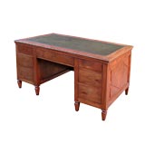 A BOLD AND WELL-PATINATED ITALIAN NEO-CLASSICAL WALNUT DESK