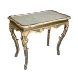 ITALIAN BAROQUE CARVED GREEN-PAINTED AND PARCEL-GILT TABLE