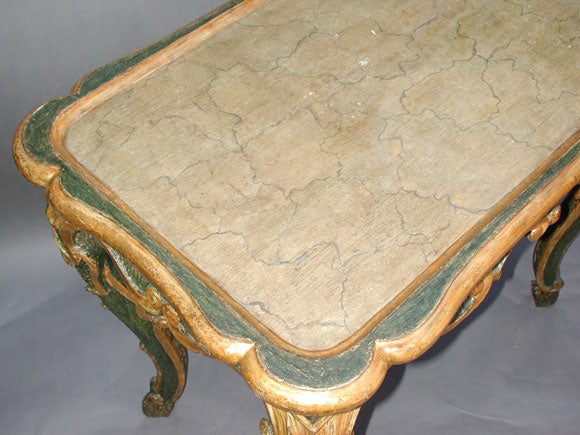ITALIAN BAROQUE CARVED GREEN-PAINTED AND PARCEL-GILT TABLE