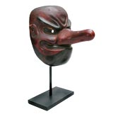 JAPANESE FOLK ART CARVED WOOD AND RED-LACQUERED MASK