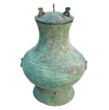 A CHINESE PATINATED BRONZE HU WITH COVER