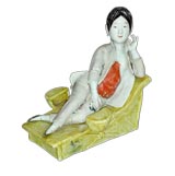 CHINESE PORCELAIN FIGURE OF A WOMAN LOUNGING  WITH BOUND FEET