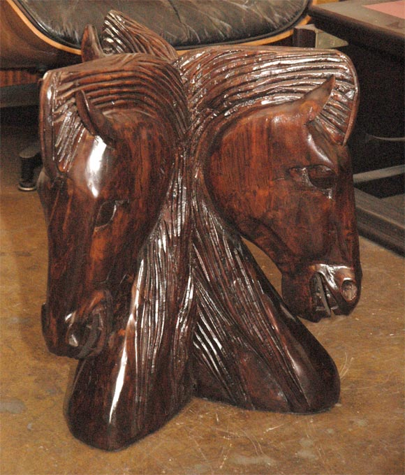 Carved horse heads round side table