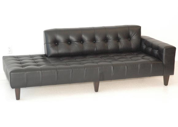 A Black Leather Biscuit-Tufted Chaise by William "Billy" Haines