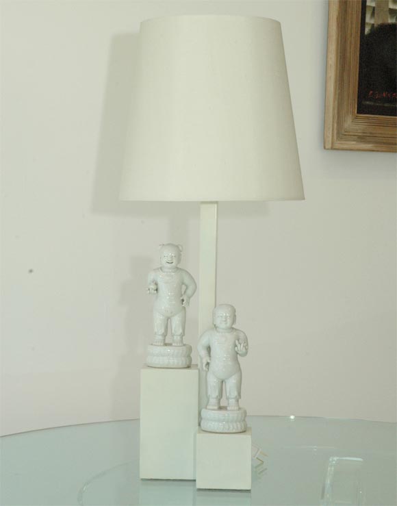 This lamp was created for the Beverly Hills home of Armand and Harriet Deutsch.  Haines used 2 Blanc de Chine figures to great effect by placing them at different heights.  The figures are vintage.  Finish  of the lamp is in excellent condition and