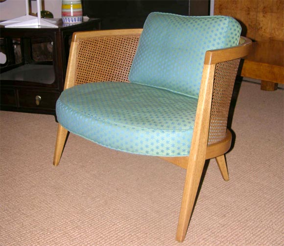 A lounge chair with mahogany frame, cane back, loose back cushion and roomy extra wide and deep construction, mod. no. 1066 by Harvey Probber. U.S.A., circa 1950. [DUF0553] [DUF0554] [DUF0555]