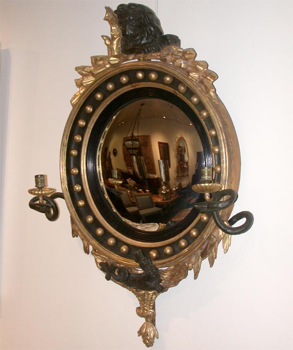 REGENCY GILTWOOD AND EBONISED CONVEX MIRROR