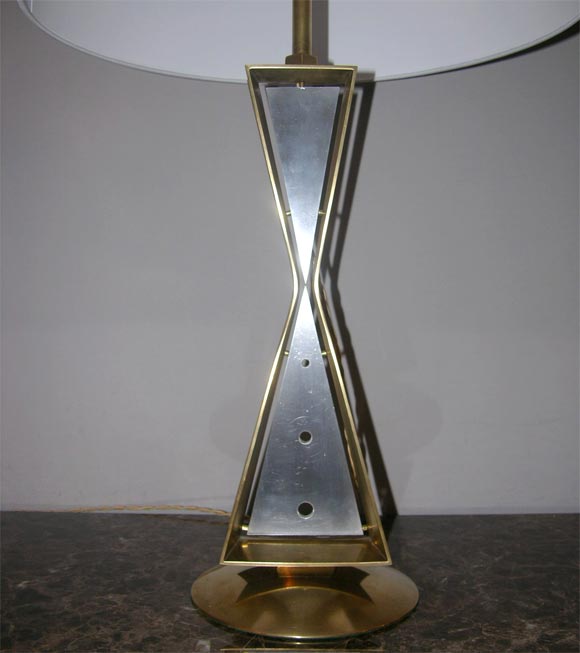 A pair of Art Deco table lamps brass and aluminum inverted triangles 1930's
New sockets and rewired
Shades not included