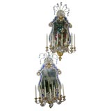Pair of gilded iron and crystal nine light mirror back sconces