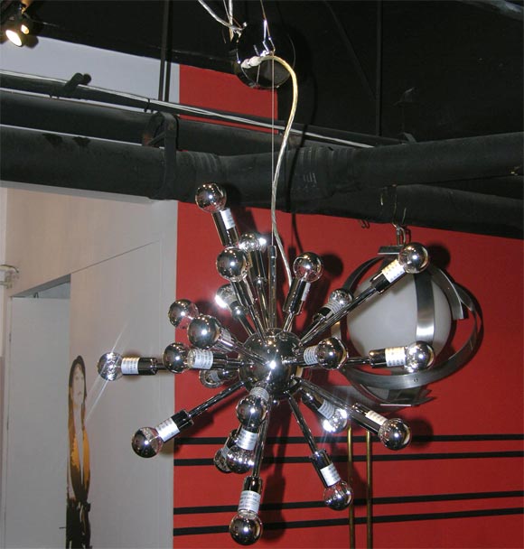 Asymmetrical sputnick chandelier with 28 light stems all in different lengths. This piece is a new reproduction item with a chrome mirror-finish. Maximum wattage per stem is 25 watts.