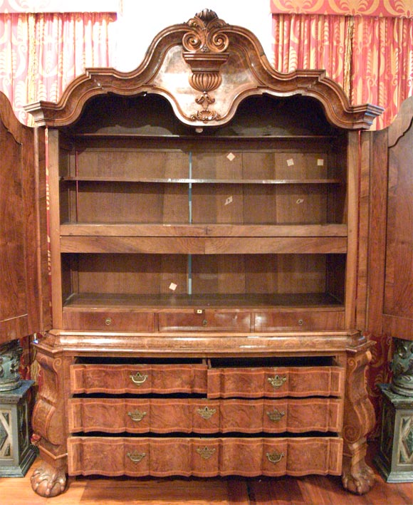Dutch 18th century burled walnut kast or linen press with claw and ball feet and secret drawers hidden in the side pieces. Truly amazing.
  