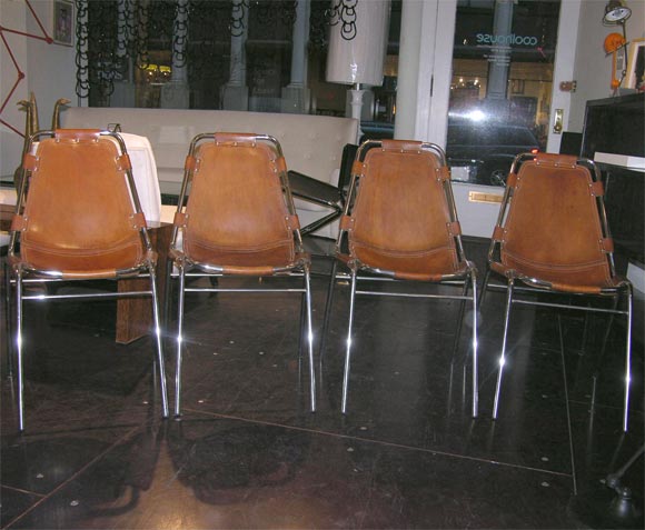 A fantastic set of 4 Charlotte Perriand leather and chrome chairs.  Very chic.