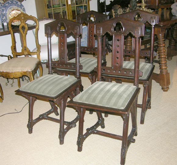 Group of four very fine mahogany Gothic Revival side chairs by the Chicago furniture maker F. W. Krause. Circa 1870. Stamped 'Patent Applied', a patent was granted for this design in 1875. 
An example of this design is pictured in 'Chicago