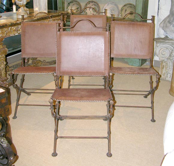 Set of four French wrought iron chairs with leather upholstery circa 1950's