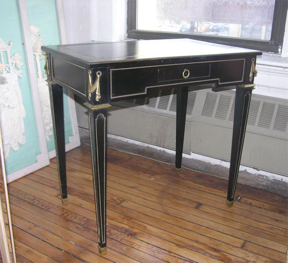 Louis XVI style writing table by Jansen. Black lacquer with orange laminate inside.