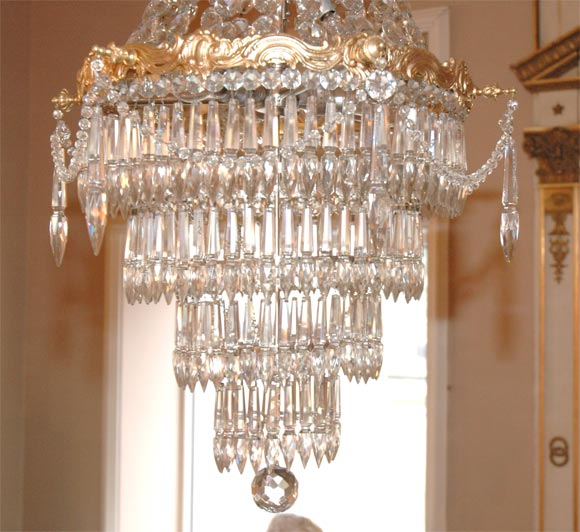French crystal and bronze dore chandelier in superior quality.  Crystals have a high lead content making them very reflective and desirable.