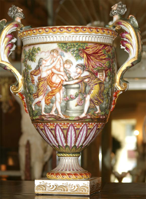 A monumental and expertly painted impressive Capodimonte urn with deep relief and fine gilding.