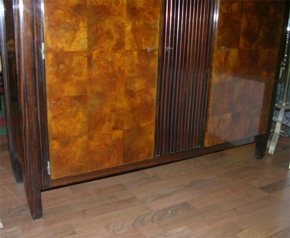 A French Art Deco cabinet by Andre Sornay (1902-2000,) circa 1920-1925, in ebony Macassar and oak, with walnut root marquetry.