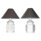 A pair of white ceramic lamps