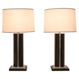 A Pair of Ebonized Wood Lamps with White Gold Accents