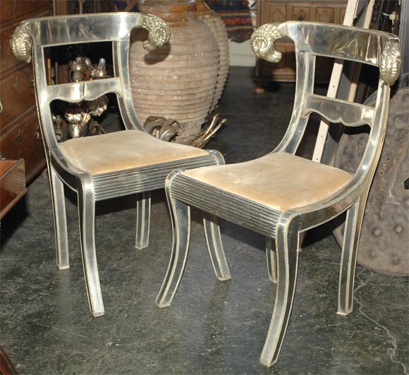 Pair of metal clad side chairs with cast bronze rams heads.  These are mid 20th century versions of early 19th century chairs