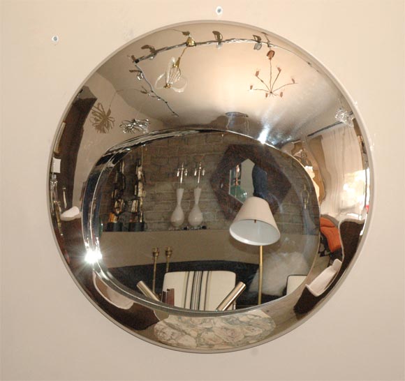 Convex spun and polished aluminium mirror.