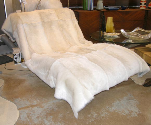 Very sexy shearling throw. Can also be used as a rug. We have one white shearling throw with raw edges.