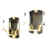 Two pairs of gilt bronze and mirrored sconces by "Leleu"