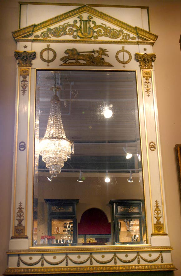 A rare Russian Empire, cream and gilt, with bronze mounts. Mounts feature bronze capitals on either side at the top. Glass is bevelled and original and beautifully aged.
The mirror could stand or hang on the wall. Exceptional beauty in excellent