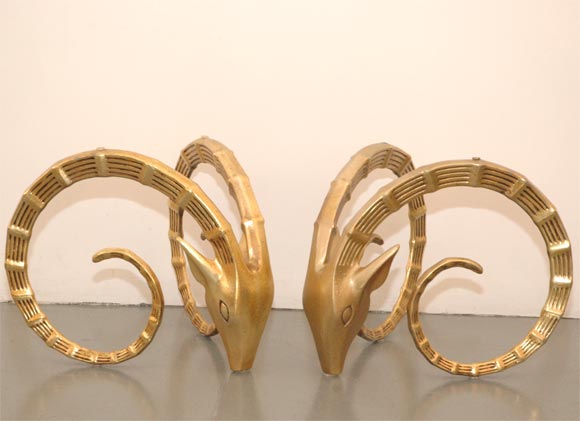 Gold gilded rams heads.  Made for a coffee table.