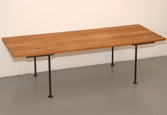 Great California modern bench with black iron legs and wood slats.  Beautiful patina to wood and legs.